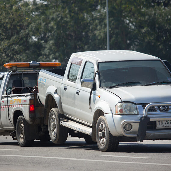 white car being towed