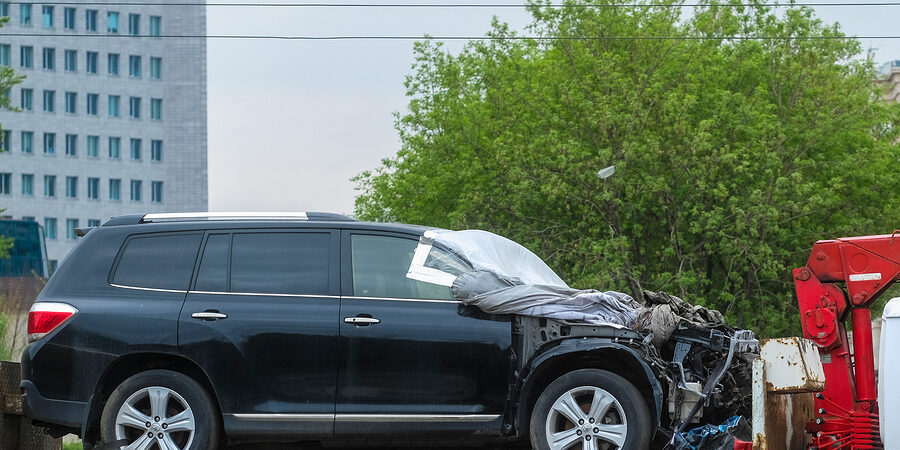 damaged car being towed